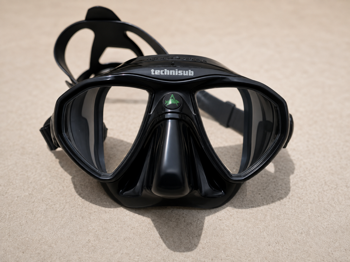 Black low-volume scuba diving mask viewed from the front